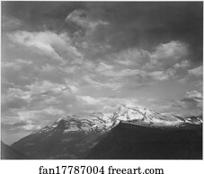 Dark foreground and clouds, mountains highlighted, "Heaven's Peak," Glacier National Park, Montana.  Photographs of National Parks and Monuments, compiled 1941 - 1942, documenting the period ca. 1933 - 1942.
