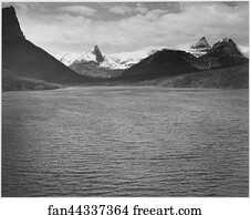 Looking across toward snow-capped mountains, lake in foreground, "St. Mary's Lake, Glacier National Park," Montana.  Photographs of National Parks and Monuments, compiled 1941 - 1942, documenting the period ca. 1933 - 1942.