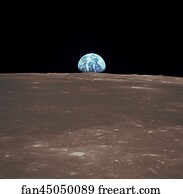 View from Apollo 11 showing Earth rising above the moon's horizon