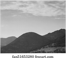 View of hill with trees, clouded sky, "In Rocky Mountain National Park," Colorado.  Photographs of National Parks and Monuments, compiled 1941 - 1942, documenting the period ca. 1933 - 1942.