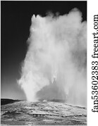 Taken at dusk or dawn from various angles during eruption. "Old Faithful Geyser, Yellowstone National Park," Wyoming. (vertical orientation).  Photographs of National Parks and Monuments, compiled 1941 - 1942, documenting the period ca. 1933 - 1942.
