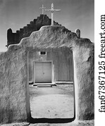 Front view of entrance, "Church, Taos Pueblo National Historic Landmark, New Mexico, 1942" [Mission de San Geronimo] (vertical orientation).  Photographs of National Parks and Monuments, compiled 1941–42, documenting the period ca. 1933–42.