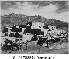 Full view of city, mountains in background, "Taos Pueblo National Historic Landmark, New Mexico, 1941.".  Photographs of National Parks and Monuments, compiled 1941 - 1942, documenting the period ca. 1933 - 1942.